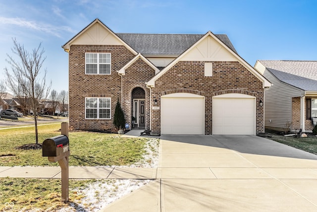 traditional-style home with a garage, brick siding, driveway, and a front lawn