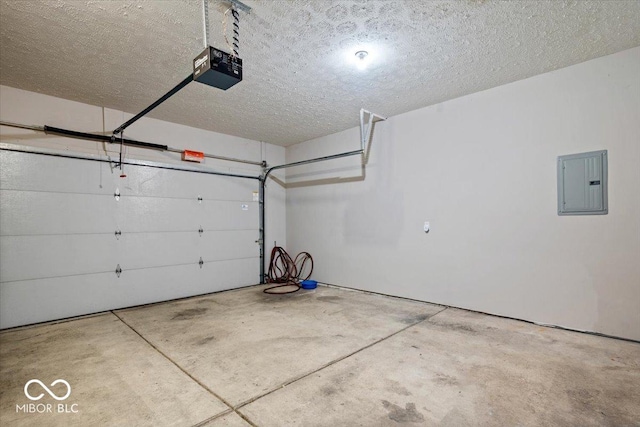 garage featuring a garage door opener and electric panel