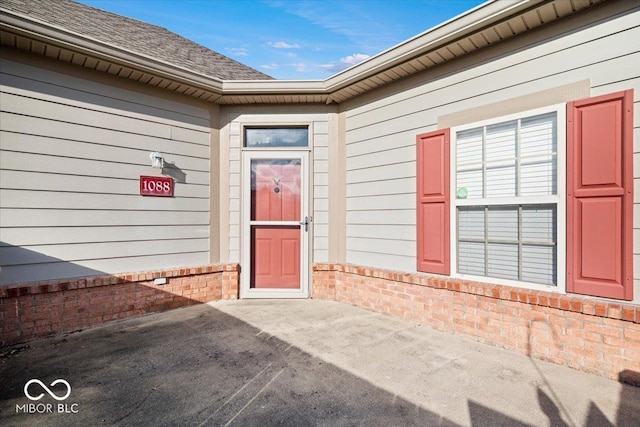 entrance to property with a patio area