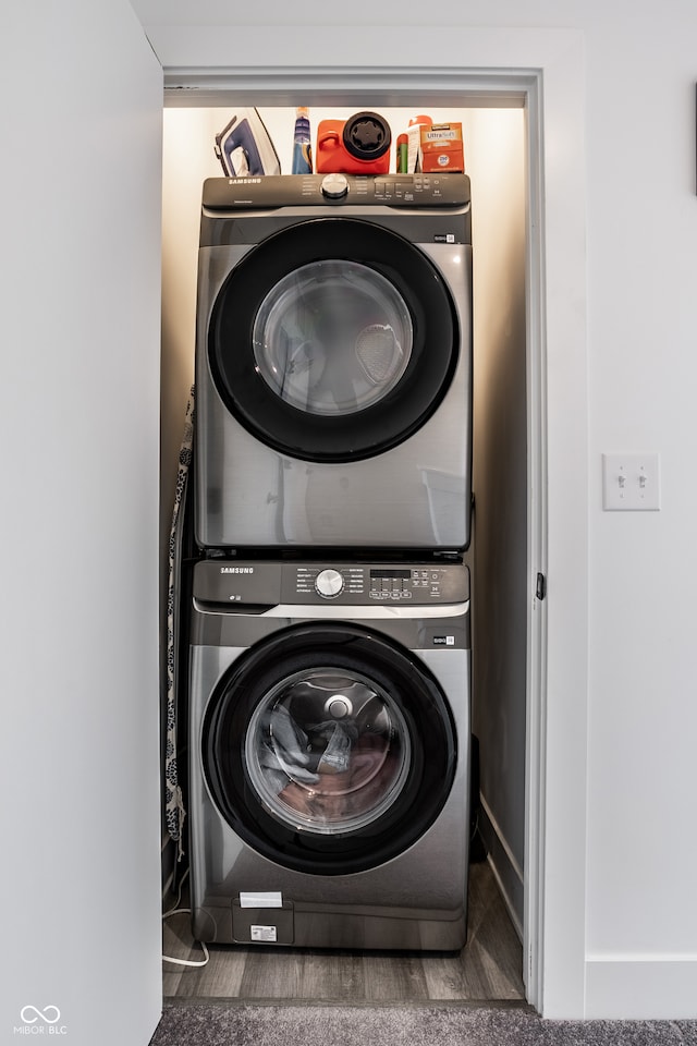 laundry area with stacked washer and clothes dryer