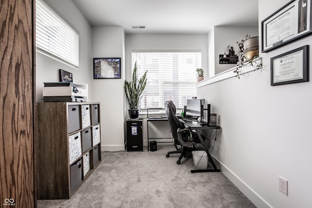 home office with light colored carpet