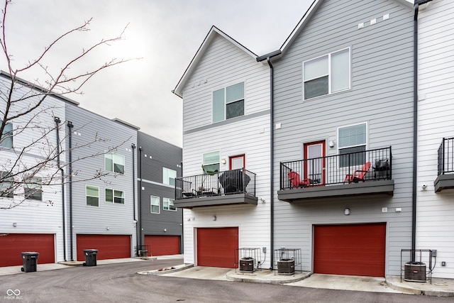 back of property featuring central AC unit