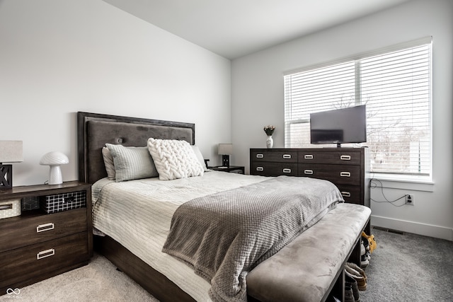 bedroom with light carpet