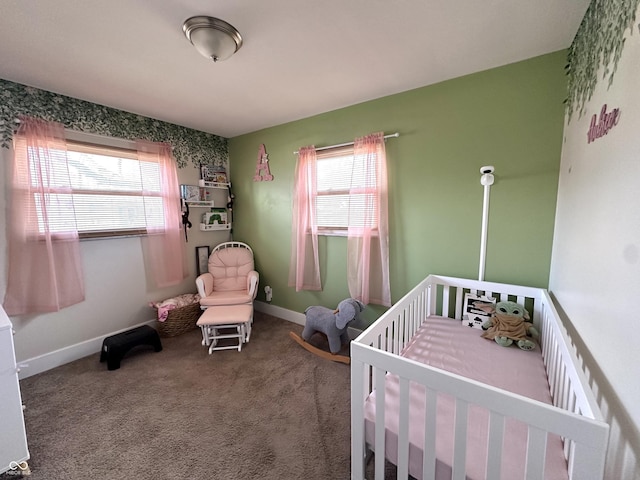 bedroom featuring carpet floors and a crib