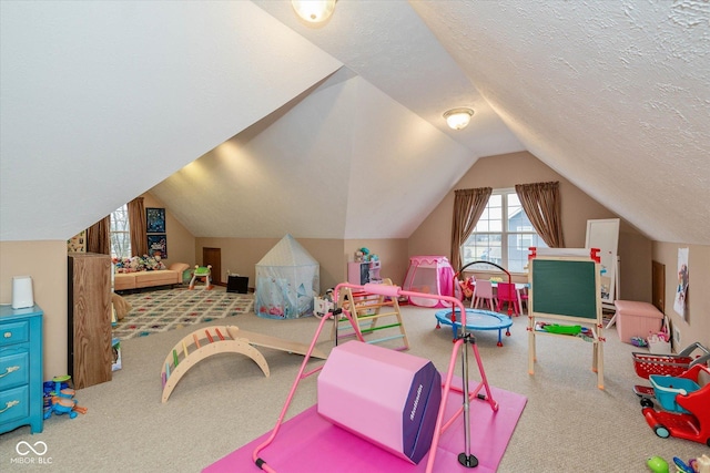 rec room with lofted ceiling, carpet flooring, and a textured ceiling