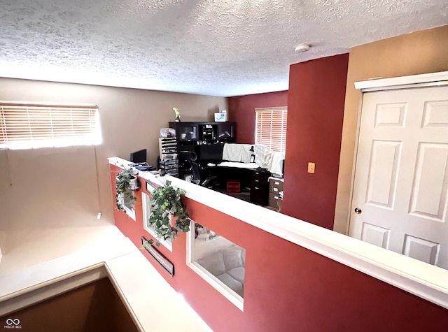 interior space featuring a textured ceiling