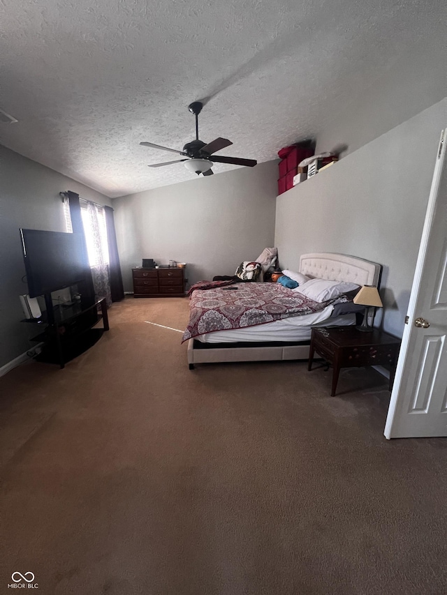 bedroom featuring carpet, a textured ceiling, and ceiling fan