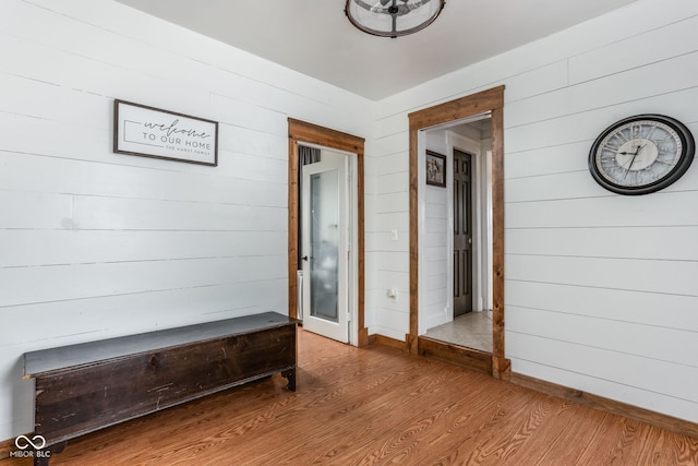 hall with wood-type flooring