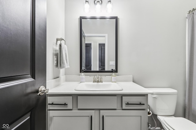 bathroom with vanity and toilet