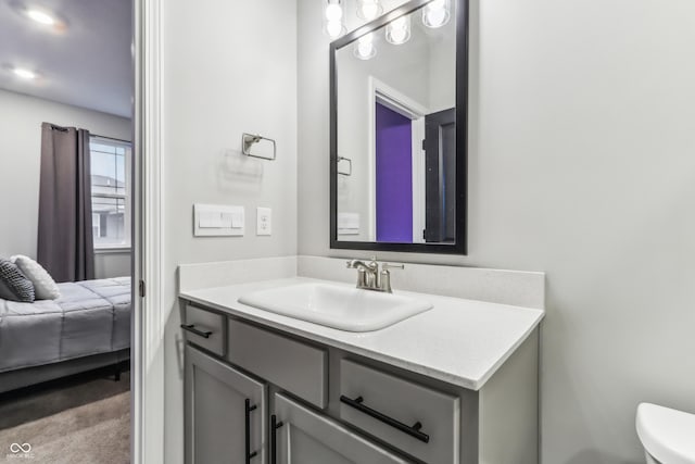 bathroom featuring vanity and toilet