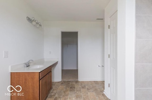 full bathroom featuring baseboards, visible vents, a closet, and vanity