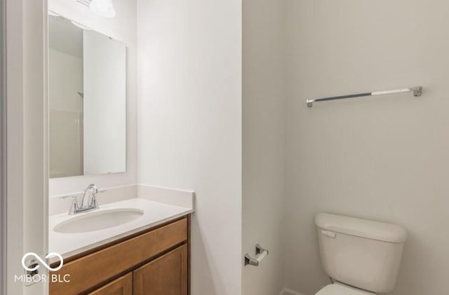 full bath featuring toilet and vanity