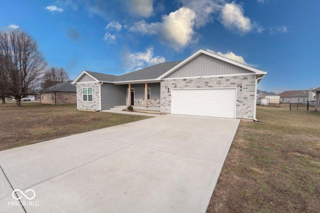 single story home featuring a garage, covered porch, and a front lawn