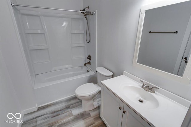 full bathroom featuring vanity, hardwood / wood-style flooring, toilet, and shower / bath combination