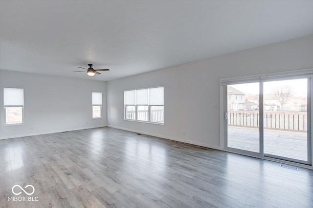 unfurnished room featuring ceiling fan and light hardwood / wood-style flooring