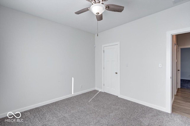 unfurnished room with ceiling fan and carpet flooring