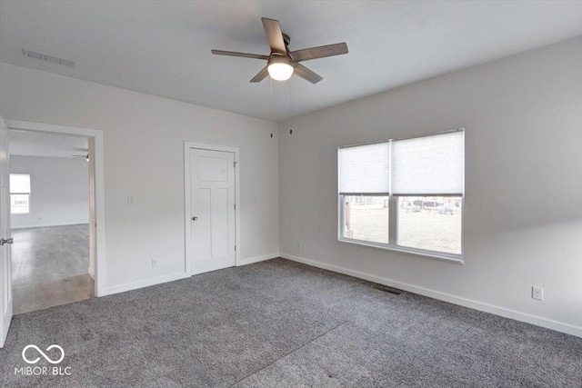 unfurnished bedroom with ceiling fan and carpet