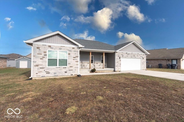 view of front of home featuring a porch, a garage, and a front yard