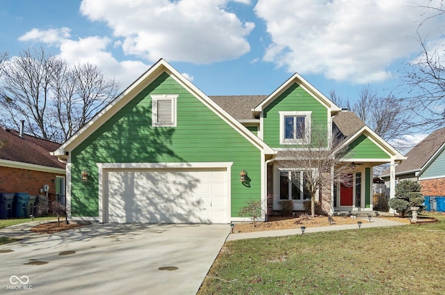 view of front of house featuring a garage and a front lawn