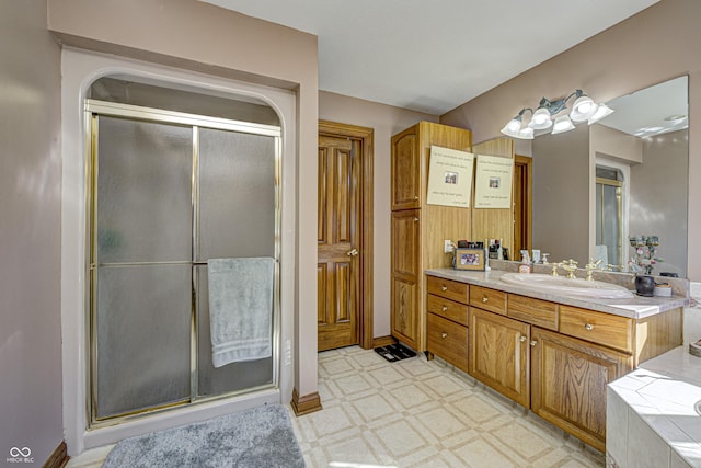 bathroom with shower with separate bathtub and vanity