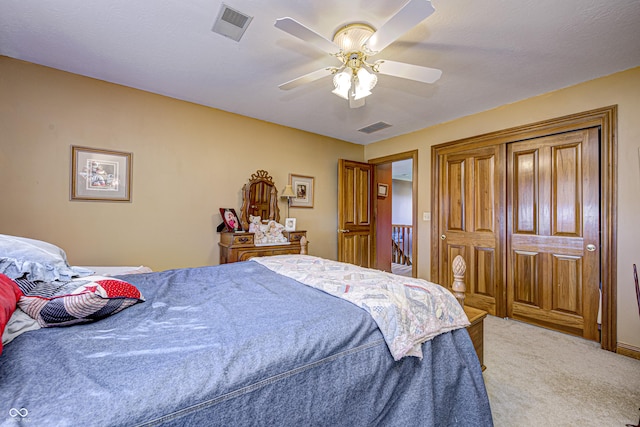 bedroom with ceiling fan and carpet floors