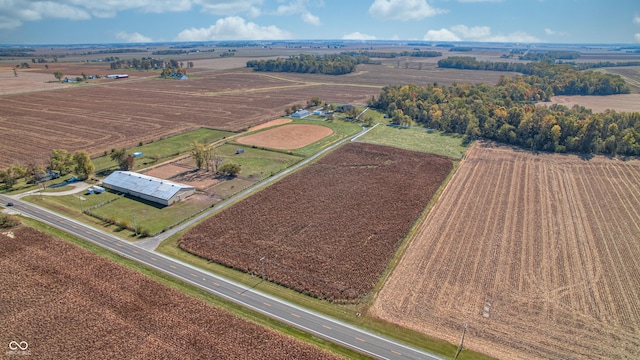 birds eye view of property with a rural view