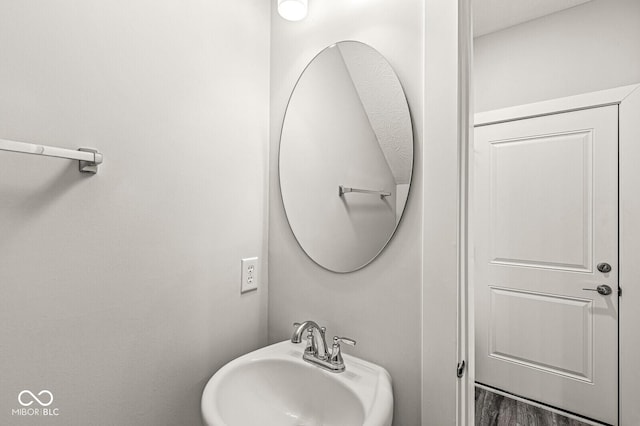 bathroom featuring a sink and wood finished floors