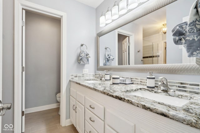 bathroom with walk in shower, wood-type flooring, vanity, and toilet