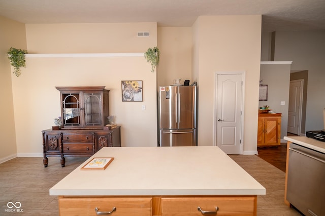 kitchen featuring appliances with stainless steel finishes and a center island