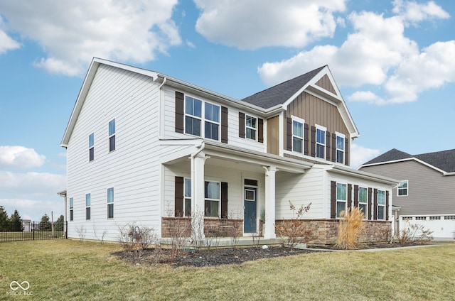 craftsman-style home with a garage and a front lawn