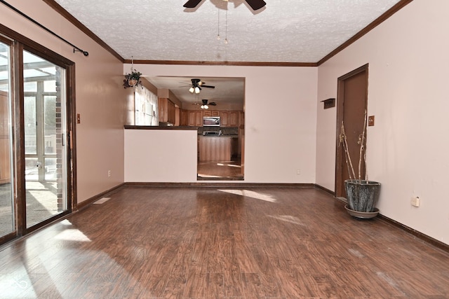 unfurnished living room featuring crown molding, dark wood-type flooring, and a textured ceiling