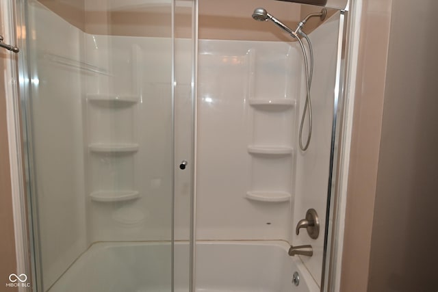 full bathroom featuring a bathtub and a shower with shower door