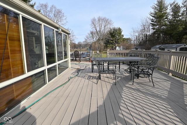 deck with outdoor dining area