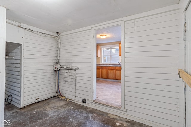 interior space featuring wooden walls