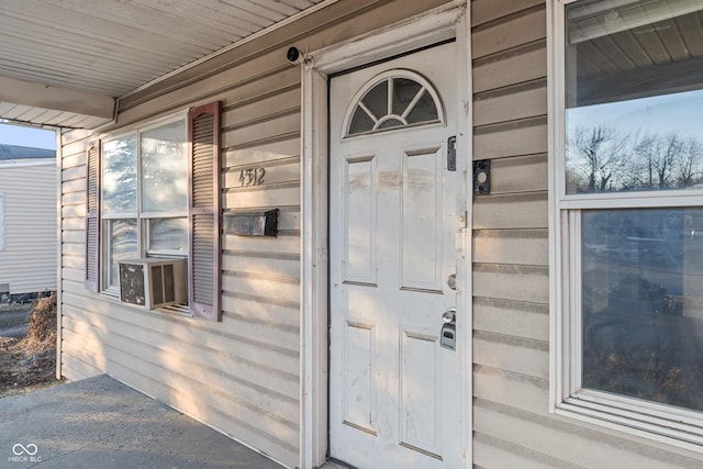 property entrance featuring cooling unit