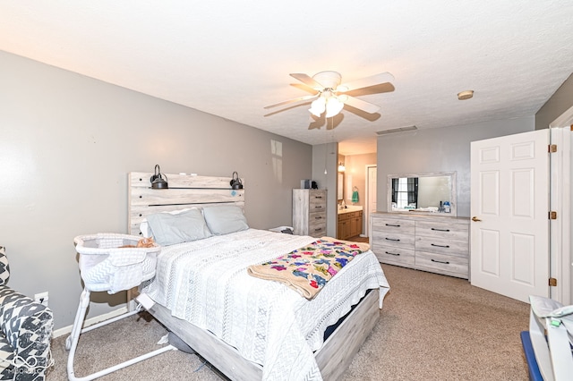 carpeted bedroom featuring a textured ceiling and ceiling fan