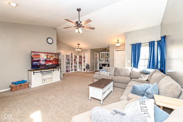 living room with ceiling fan with notable chandelier, lofted ceiling, and light carpet