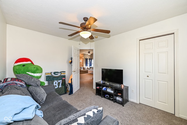 living room featuring light carpet and a textured ceiling