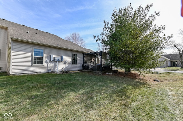 exterior space with a pergola and a lawn