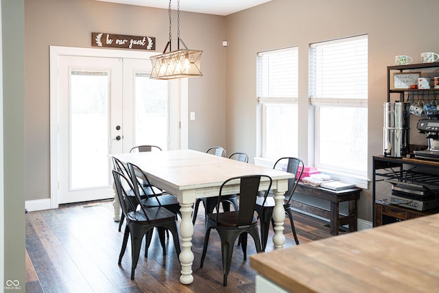 dining area featuring french doors and dark hardwood / wood-style floors