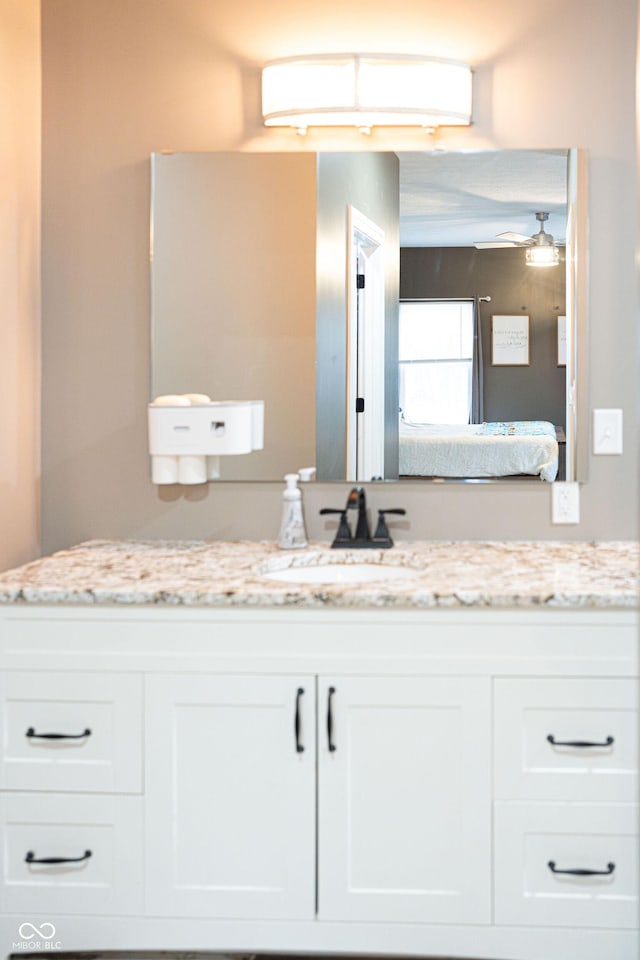 bathroom with vanity and ceiling fan