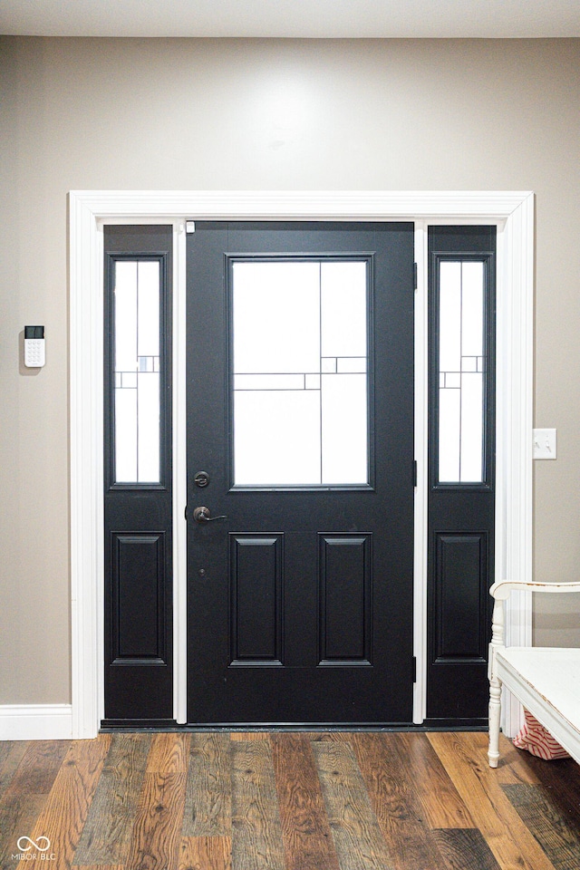 foyer entrance with dark wood-type flooring