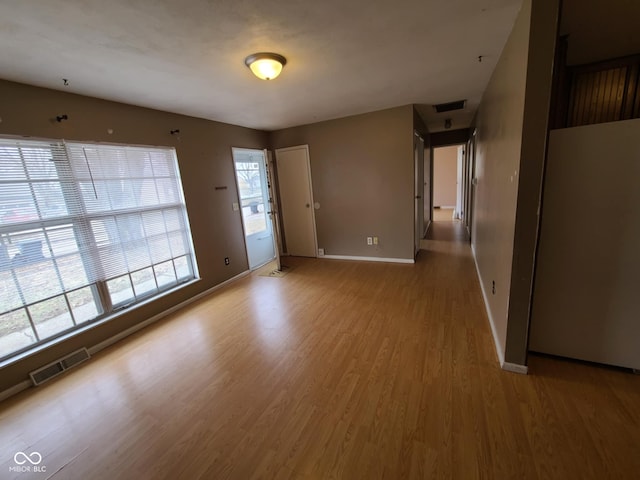 unfurnished room featuring light hardwood / wood-style floors