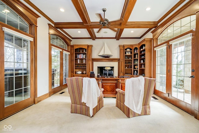 sitting room with light carpet, plenty of natural light, coffered ceiling, and beamed ceiling