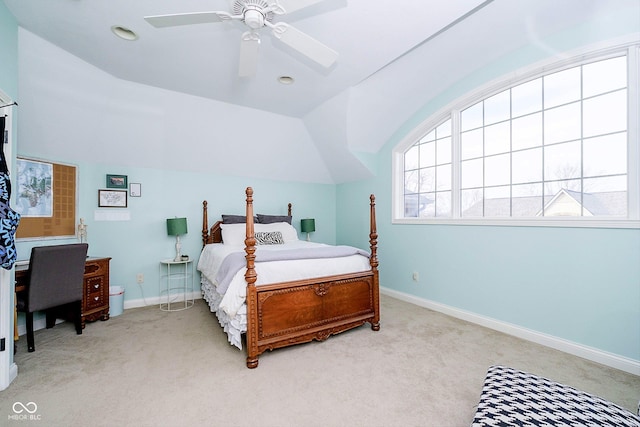 bedroom with ceiling fan, light colored carpet, lofted ceiling, and multiple windows