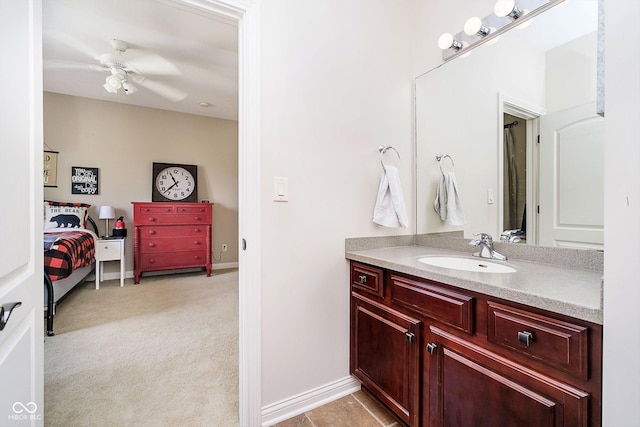 bathroom featuring ceiling fan and vanity