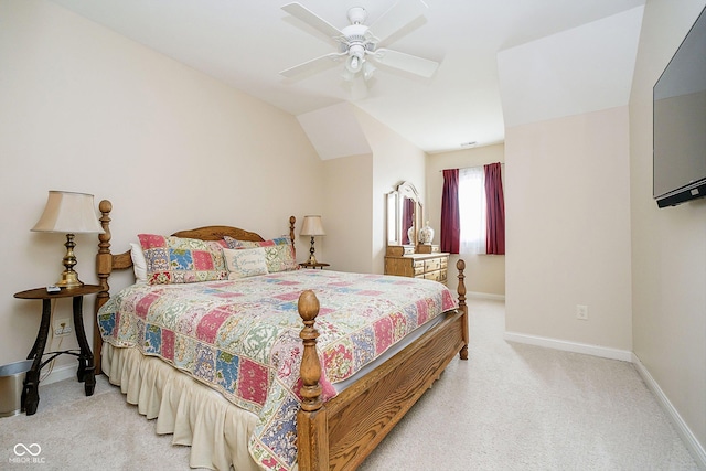 carpeted bedroom with lofted ceiling and ceiling fan