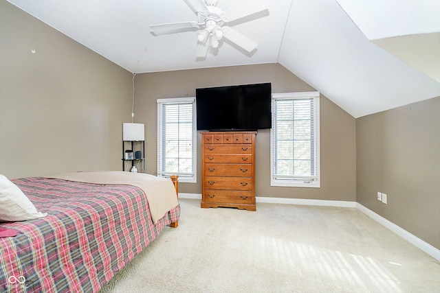 bedroom with vaulted ceiling, carpet flooring, and ceiling fan