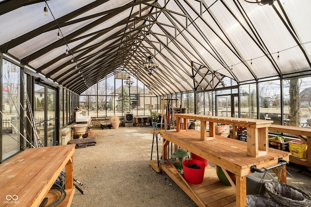 sunroom / solarium featuring vaulted ceiling