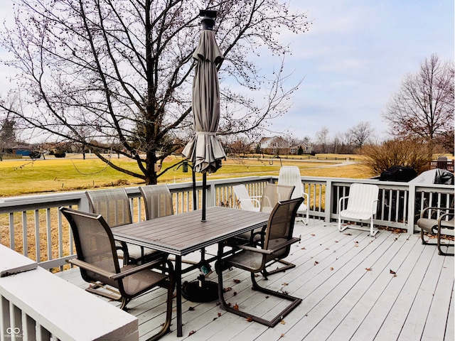 wooden deck with a yard